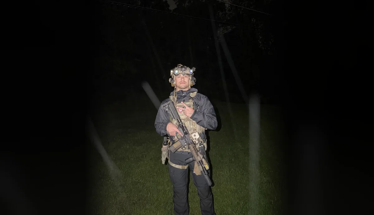 Night vision equipment worn in an outdoor nighttime setting